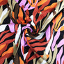 ABSTRACT LEAVES - BURNT ORANGE VISCOSE JERSEY 98% VISCOSE 2% SPANDEX 145cm WIDE