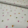 Fabric with colorful heart patterns on a white background
THE DRESSMAKER FABRICS