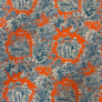 A close-up of a fabric pattern featuring a vibrant orange background with a classic toile de Jouy design in slate blue, including palm trees, elephants, and tropical motifs.
THE DRESSMAKER FABRICS