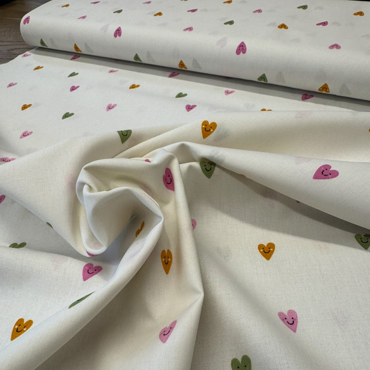 SMILEY HEARTS 
RAINBOW STRIPE 
100% FINE COTTON POPLIN  
THE DRESSMAKER FABRICS 
SEWING BEE 