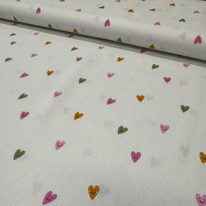 Fabric with colorful heart patterns on a white background
THE DRESSMAKER FABRICS 