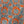A close-up of a fabric pattern featuring a vibrant orange background with a classic toile de Jouy design in slate blue, including palm trees, elephants, and tropical motifs.
THE DRESSMAKER FABRICS