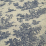 Close-up of a woven fabric with a classic toile de Jouy pattern featuring dark blue figures, animals, and foliage on a warm beige linen background.
THE DRESSMAKER FABRICS 