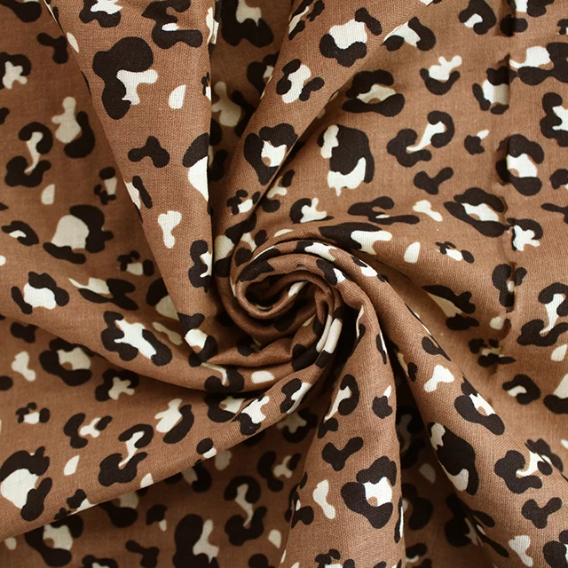 AMINAL LEAOPARD PRINT RUST 
FLAT DOUBLE GAUZE MUSLIN 
100% COTTON
THE DRESSMAKER FABRICS 